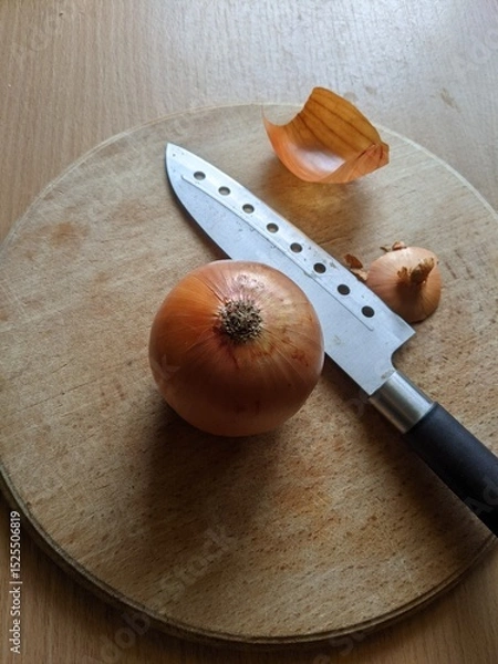 Fototapeta Onion and Knife on Cutting Board