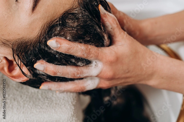 Fototapeta Close‑up spa scalp shampoo foaming on hair during professional scalp treatment
