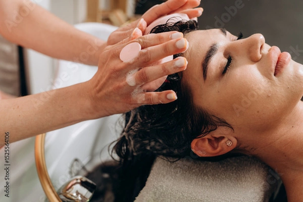 Fototapeta "Spa scalp shampoo session with foaming bubbles and vibrating electric massager for relaxation