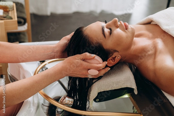 Fototapeta "Spa scalp shampoo session with foaming bubbles and vibrating electric massager for relaxation