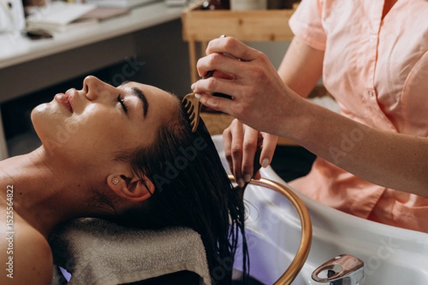 Fototapeta Scalp spa massage using comb tools for relaxation and head‑care treatment