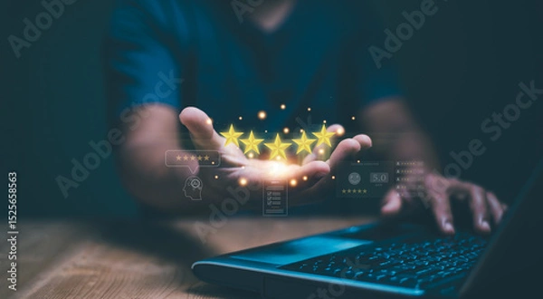 Fototapeta Customer satisfaction concept. Hand holding golden five stars for excellent evaluate of product or service by use AI technology. Innovative leveraging AI to elevate customer service standard.
