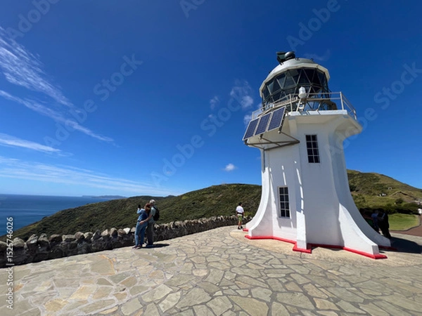 Fototapeta Tourists visit at Cape Reinga Lighthouse at the edge of the Northland, New Zealand