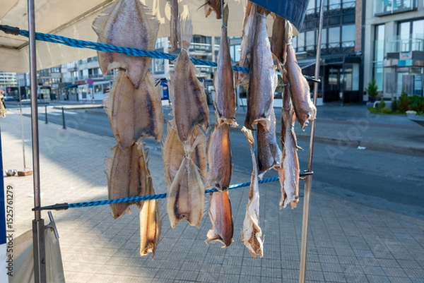 Obraz Dtied on air or salted stock fish on sea promenade in Oostende, Belgium