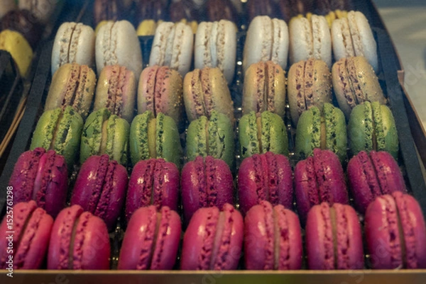 Obraz Macarons or French macaroon sweet meringue-based confection made with egg white, icing sugar, granulated sugar, almond meal, and food colouring, sweet french dessert on display
