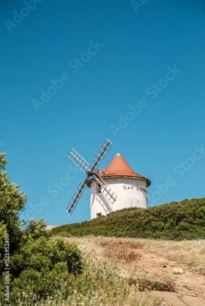 Fototapeta The Moulin Mattei windmill, built at the end of the 18th century, stands on the Cap Corse peninsula on the Mediterranean island of Corsica