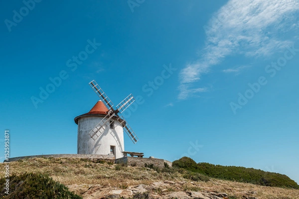 Fototapeta The Moulin Mattei windmill, built at the end of the 18th century, stands on the Cap Corse peninsula on the Mediterranean island of Corsica