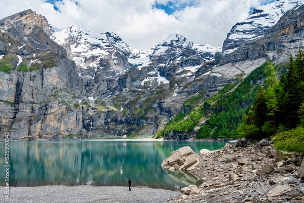 Fototapeta The Oeschinensee with a man in front