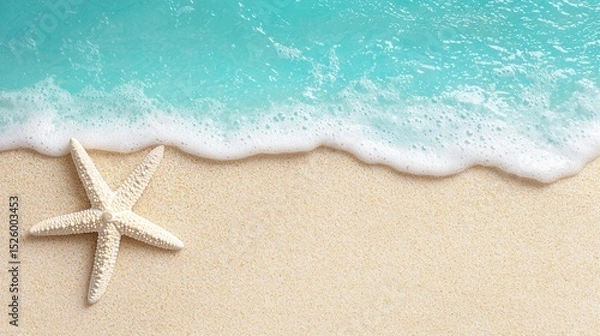 Fototapeta summer concept. Beach scene with a starfish and turquoise water at the shoreline.