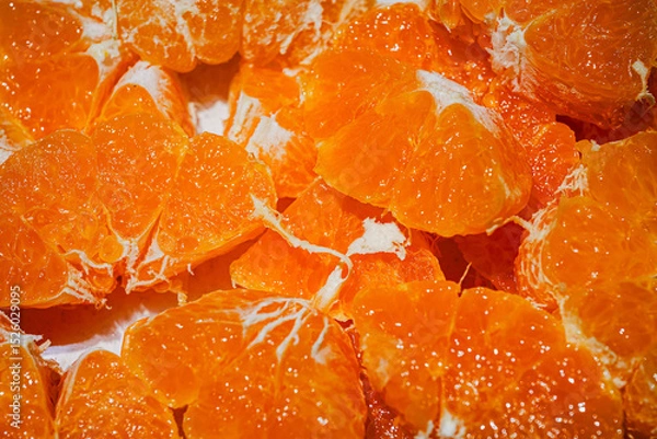 Obraz Fresh Orange Slices on Orange Background – Citrus Fruit Texture and Pattern
