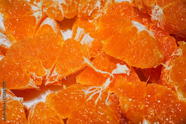 Obraz Fresh Orange Slices on Orange Background – Citrus Fruit Texture and Pattern