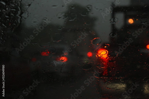 Fototapeta car on highway road in the night with heavy rainny season, blurred image