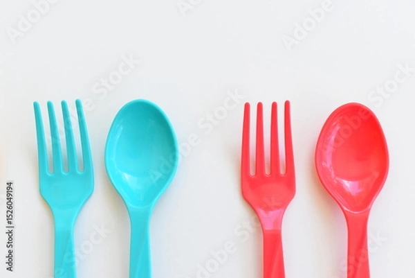 Fototapeta colorful spoon and fork isolated on white background, plastic cutlery for picnic