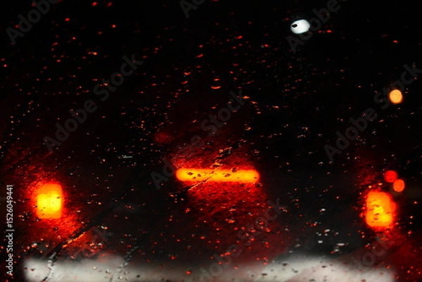 Fototapeta car on highway road in the night with heavy rainny season, blurred image