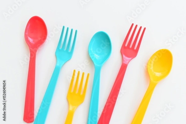Fototapeta colorful spoon and fork isolated on white background, plastic cutlery for picnic