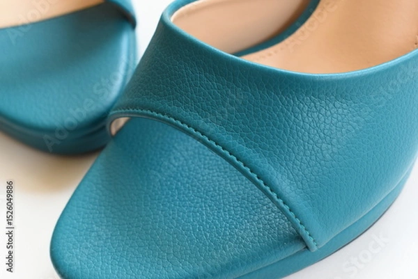 Fototapeta texture of green high heels shoes on white background