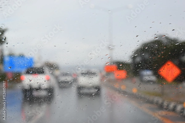 Fototapeta car on highway road with rainny season, blurred image