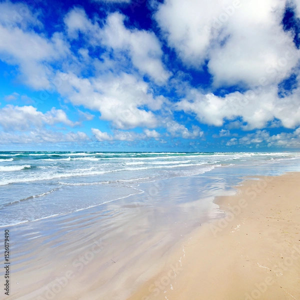 Fototapeta endless beach with white sand and beautiful blue summer sky with white clouds, Embracing Freedom 