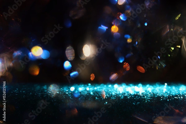 Fototapeta abstract glitter blue and gold lights background. de-focused