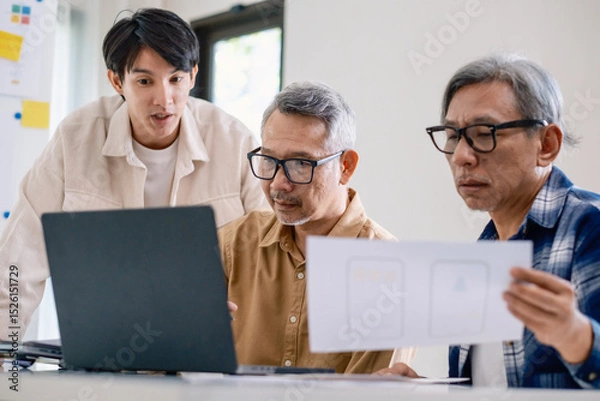 Fototapeta Asian Instructor Teaching Senior in Software Programming and Training Collaboration