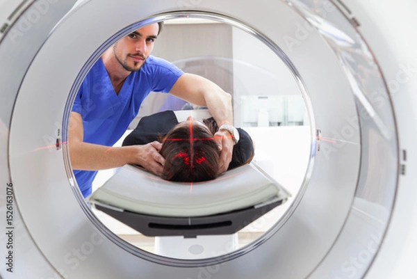 Fototapeta A Doctor is PPreparing Patient for a CT Scan in Modern Hospital