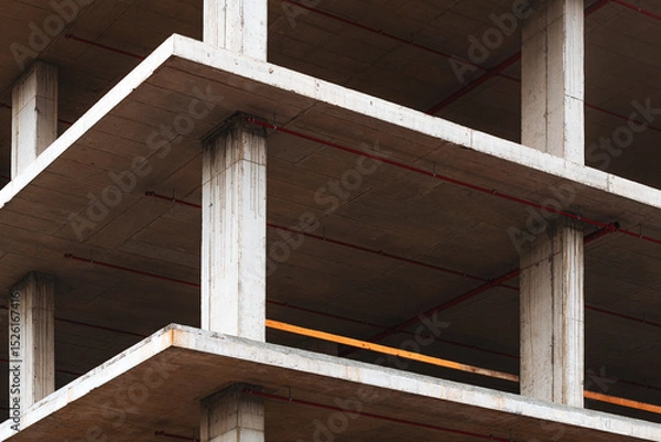 Fototapeta Concrete frame structure of residential building