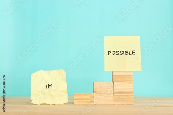 Fototapeta The word impossible is divided into two parts. success and challenge concept.