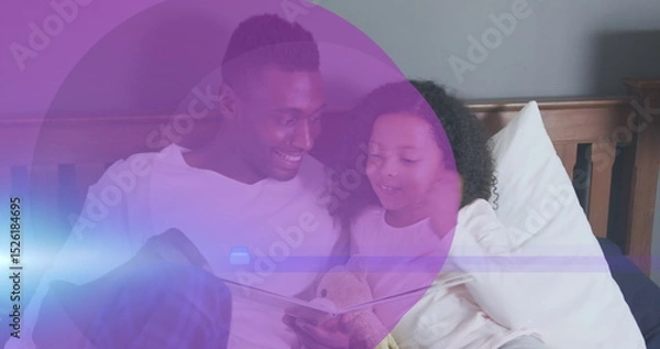 Fototapeta Image of purple circles over african american man and his daughter reading book together