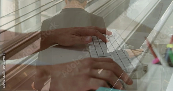 Fototapeta Image of hands using computer over caucasian businessman at airport
