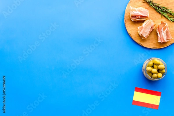 Obraz Welcome to Spain. Parma ham and Spanish flag, top view