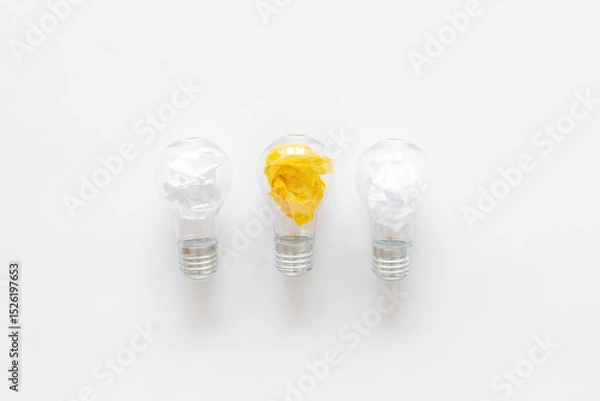 Obraz Yellow paper in light bulb, top view. Education concept. Creative idea and business innovation