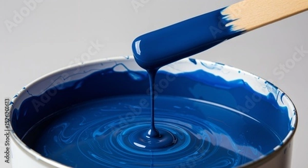 Fototapeta High-Quality Blue Paint in Open Can with Stirring Stick for Home Improvement Projects