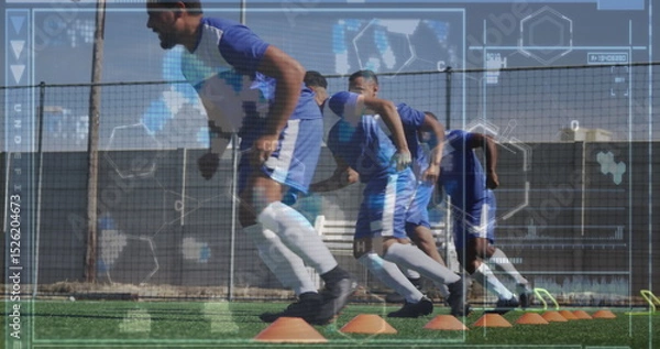 Obraz Image of screen with biological data over diverse male soccer players during training