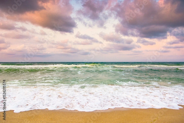Fototapeta cloudy evening sky at the black sea. travel inspiration. weather change in nature. beautiful orange cloudscape. dramatic summer vacation in europe at the beach