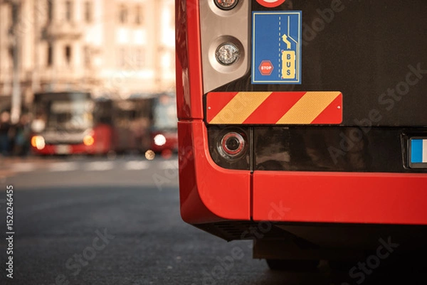 Fototapeta Red bus for public transportation parked on a station.