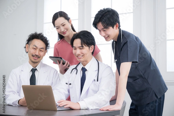 Fototapeta Doctors in brightly lit medical offices and hospitals meeting for check-ins, sharing, meetings, etc. Image of supervisors and residents