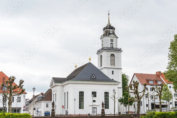 Obraz A white Friedenskirche church with a clock tower and a steeple in Saarbrucken Germany
