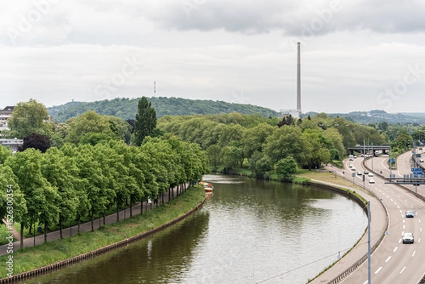 Obraz A Saar river runs through a forest and a highway in Saarbrucken Germany