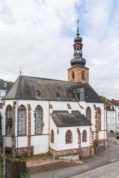 Obraz A large castle church with a steeple and a clock tower in Saarbrucken Germany