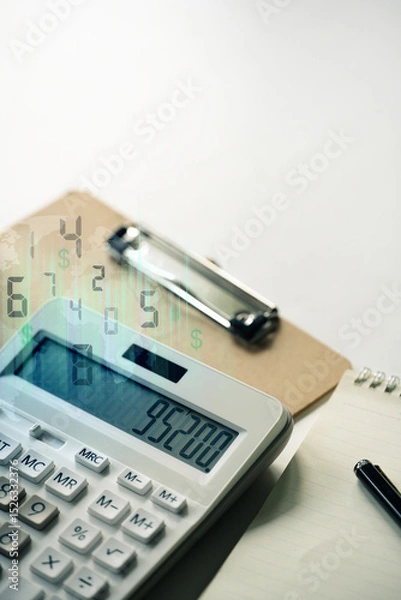 Fototapeta Calculator with financial figures and a digital overlay, representing accounting and financial analysis