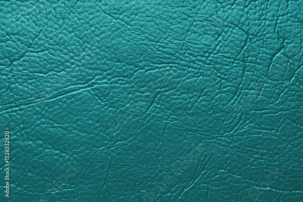 Fototapeta Close up, macro texture of turquoise glossy natural genuine leather, leatherette structure, artifical skin surface with embossed pattern. Background, wallpaper, backdrop