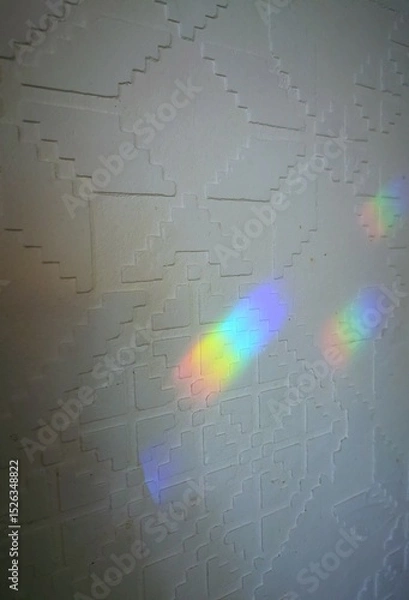 Obraz Rainbow light reflection on white wall with geometric pattern background