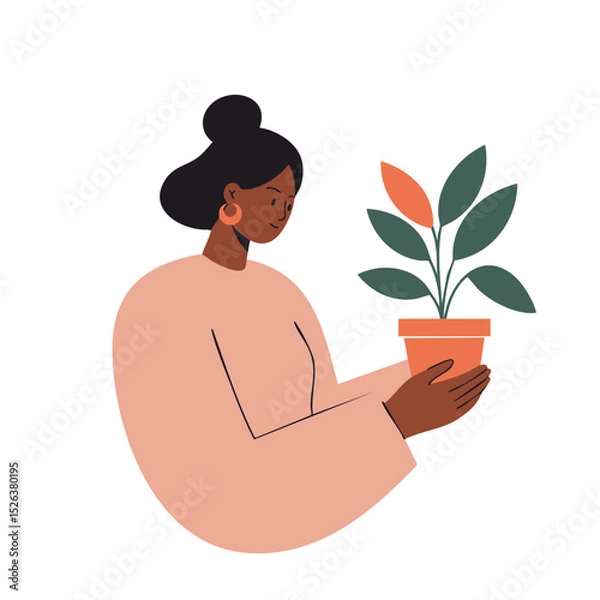 Fototapeta Black woman with hair in a bun in a gentle mood holding a potted plant against a white background with copy space.
