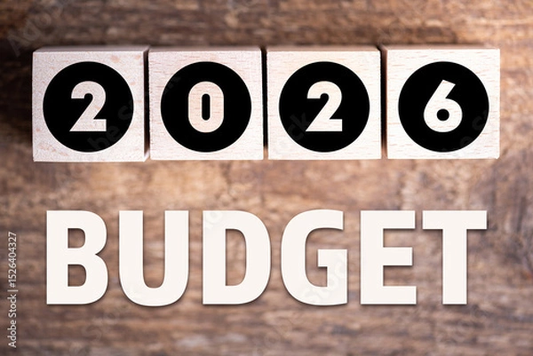 Fototapeta Budget 2026 new year on wooden blocks and office business concept background. 2026 Budget planning and allocation concept concept. 2026 New year resolutions, goals