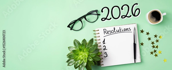 Fototapeta New year resolutions 2026 on desk. 2026 resolutions list with notebook, coffee cup on table. Goals, resolutions, plan, action, checklist concept. New Year 2026 template, copy space
