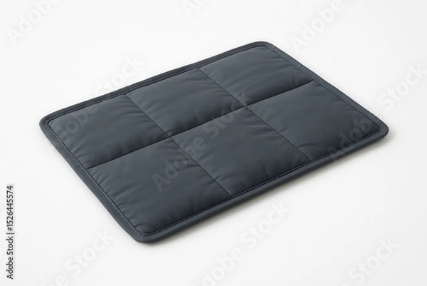 Fototapeta Gray weighted blanket resting on white background