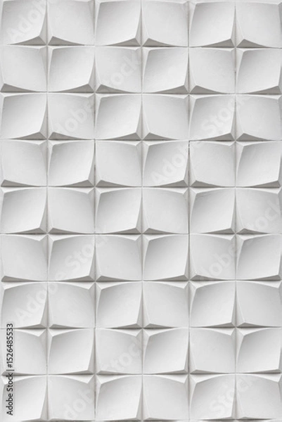 Fototapeta A white wall covered with three-dimensional tiles forming a geometric pattern. Textured plaster