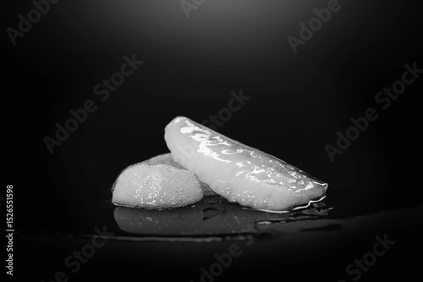 Obraz Melting Ice. A piece of melting ice on a dark