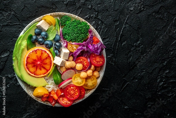 Fototapeta Buddha Bowl. Rainbow salad. Vegan poke bowl with avocado. Healthy food. Overhead flat lay shot with a place for text