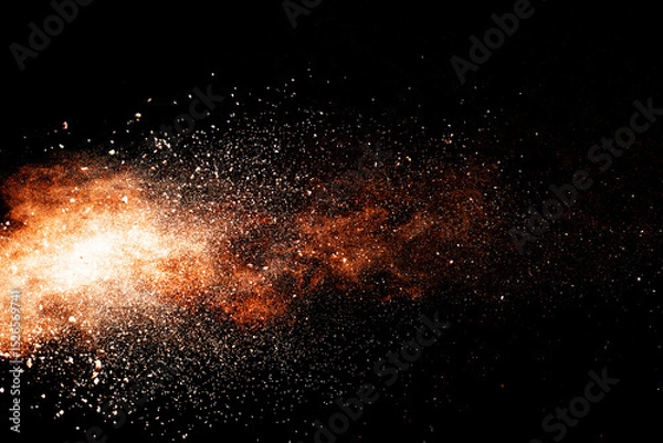 Fototapeta Abstract orange powder explosion isolated on black background